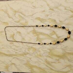 Black and white costume necklace. Long chain.